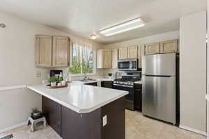 Cute Kitchen with Stainless Steel Appliances