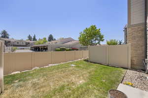 View of yard with fence and a residential view