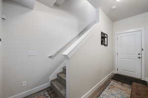 Interior space with baseboards and wood finished floors