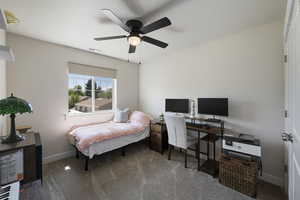 Bedroom with carpet flooring, a ceiling fan, baseboards, and visible vents