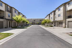 View of street with a residential view, sidewalks, and curbs