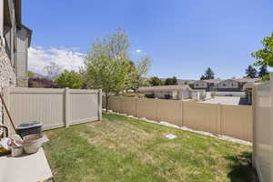 View of yard featuring a fenced backyard and a residential view