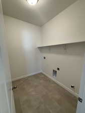 Washroom with laundry area, washer hookup, and baseboards