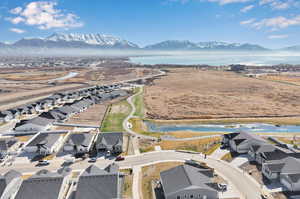 Drone / aerial view featuring a residential view and a water and mountain view