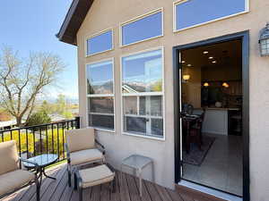 Access to the back deck from the kitchen/dining area of the main floor. Relax and enjoy the panoramic views of the mountains and valley.
