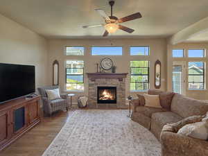 Spacious but cozy family room with large windows to enjoy the mountain views and a fireplace for added warmth.