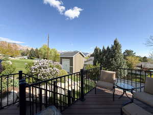 Access to the back deck from the kitchen/dining area of the main floor. Relax and enjoy the panoramic views of the mountains and valley.