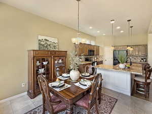 Elegant kitchen and dining space, large windows for calming natural light.