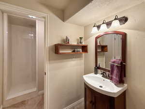 Finished basement bathroom perfect for guests or private use.