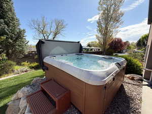 Beautiful yard with a hot tub (included) and amazing view of the valley.