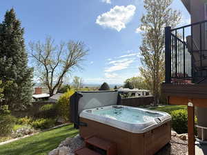 Beautiful yard with a hot tub (included) and amazing view of the valley.