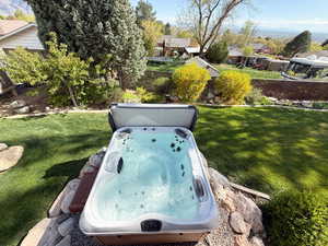 Beautiful yard with a hot tub (included) and amazing view of the valley.
