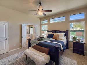 Spacious primary suite with large windows, natural light, and breathtaking views of the mountains.