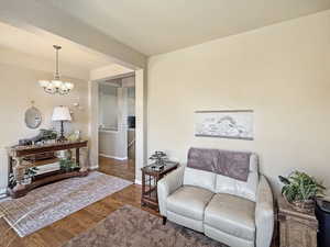 Beautiful foyer entry with attached formal living room and real hardwood floors.