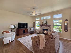Spacious but cozy family room with large windows to enjoy the mountain views and a fireplace for added warmth.