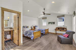Bedroom with recessed lighting, baseboards, wood finished floors, and lofted ceiling
