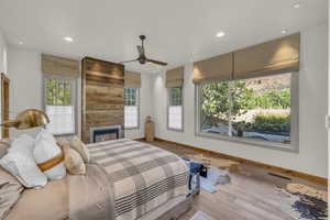 Bedroom featuring multiple windows, recessed lighting, and visible vents
