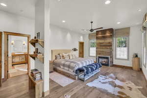 Bedroom with wood-type flooring, recessed lighting, and baseboards