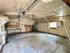 Garage featuring gas water heater