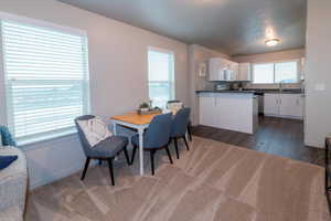 Dining room with baseboards and wood finished floors