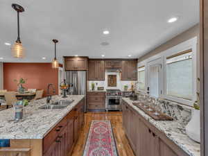 Premium Wolf range and custom cabinets make your kitchen a family chef's dream