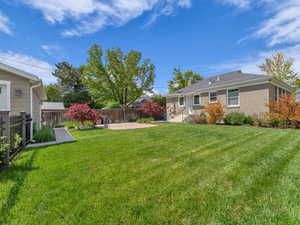 View of backyard with a patio and immaculate landscaping