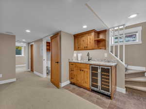 The basement wet bar is right next to the open theater space for convenience