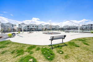 View of community featuring a residential view, fence, and a lawn