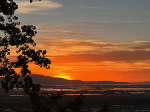 Sunset, mountains, water from the deck