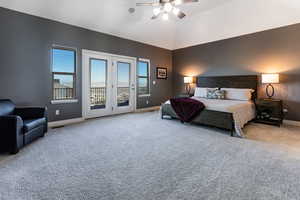 Carpeted bedroom featuring baseboards, access to outside, ceiling fan, and visible vents