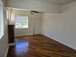 Interior space featuring baseboards, ceiling fan, and wood finished floors