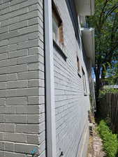 View of side of property with fence