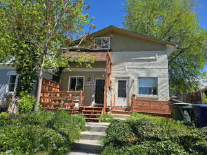 Bungalow-style house with fence and a deck