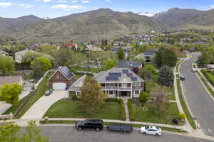 Drone / aerial view featuring a mountain view and a residential view