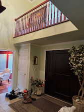 View of exterior entry with a balcony