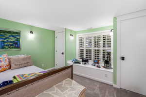 Carpeted bedroom with baseboards