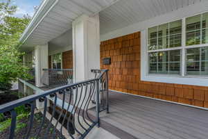 Wooden deck featuring covered porch