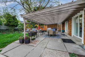 View of patio featuring a pergola, a grill, a fenced backyard, an outdoor living space, and outdoor dining space