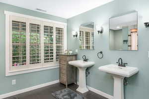 Bathroom featuring visible vents, baseboards, and tile patterned flooring