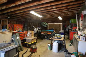 Basement featuring a workshop area and a garage