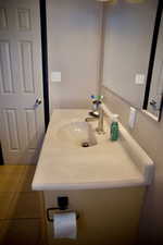 Bathroom featuring vanity and tile patterned flooring