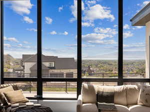 Sunroom featuring a healthy amount of sunlight and a mountain view