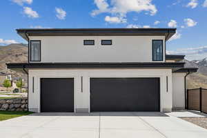 Exterior space with a mountain view and driveway