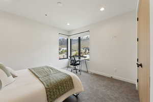 Bedroom with carpet floors, recessed lighting, baseboards, and a mountain view