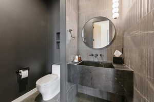 Bathroom with tile patterned flooring and toilet