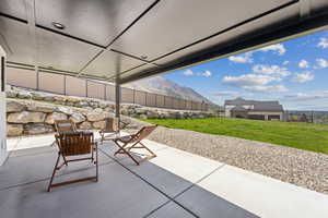 View of patio with fence
