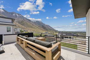 Exterior space featuring a mountain view and a balcony