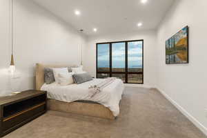 Carpeted bedroom featuring recessed lighting and baseboards