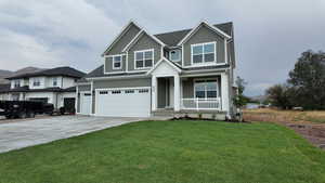 Craftsman house featuring driveway, a porch, a garage, a front yard, and roof with shingles
