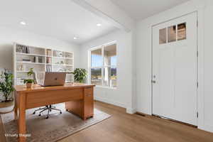 Office area with light wood-type flooring, baseboards, and recessed lighting